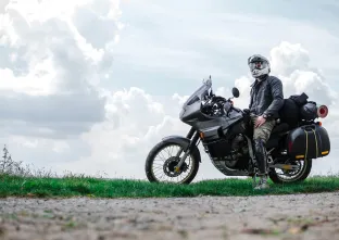 motorbike and biker at side of the road